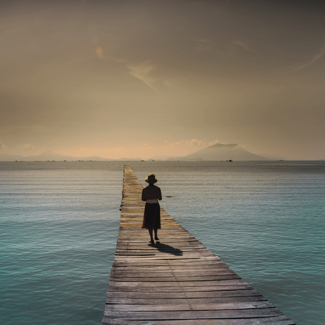 The Distance We’ve Had to Travel to Survive A quiet path through nature representing the emotional distance people travel to survive and reconnect with themselves